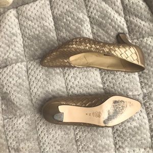 Size 10 gold pumps with 2 inch heel. Mild wear, no stains rips or tears.